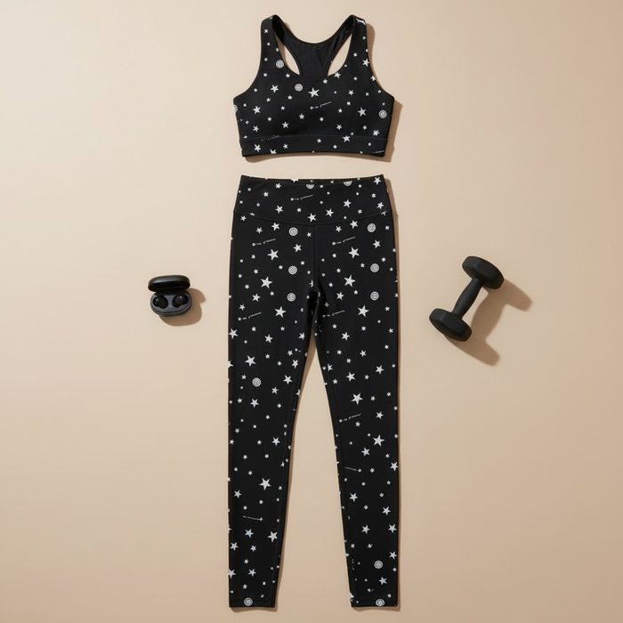 Minimalist flat lay with star print activewear set and weights
